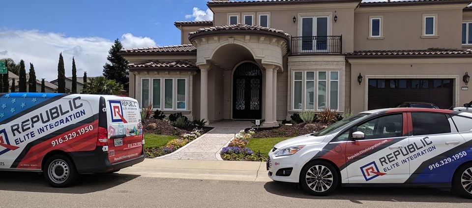 REI cars in front of a house