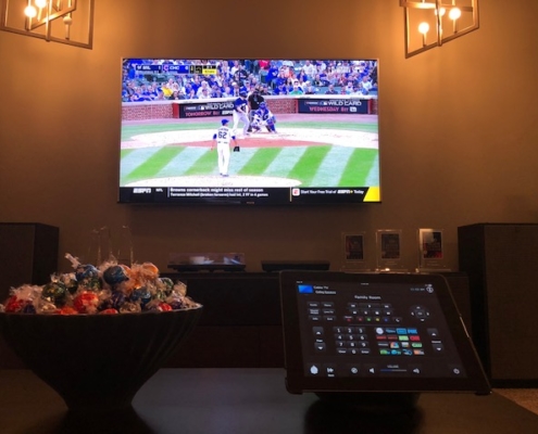 Baseball game on tv with Control4 panel displayed