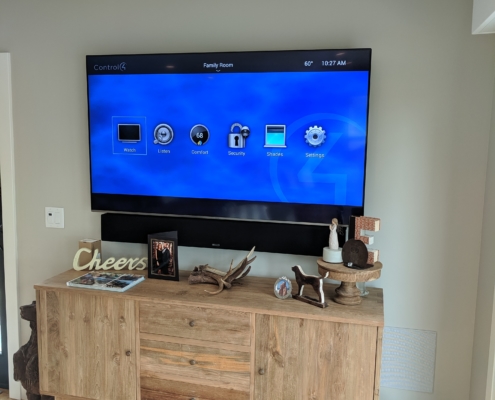 Home TV setup with Control4 home navigation screen up